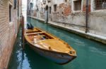 Motorboat Moored In A Canal In Venice Stock Photo