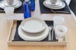 Table Set On Wooden Table In Dinning Room Stock Photo