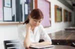 Portrait Of Thai Adult Businesswoman Beautiful Girl Using Her Tablet Stock Photo