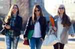 Three Students Girls Walking In The Campus Of University Stock Photo