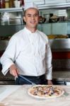 Chef With Prepared Pizza Dough Stock Photo