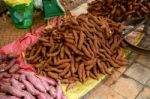 Sweet Potato Stack On Ground For Sale At The Market Stock Photo