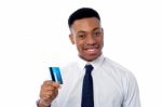 Cheerful Businessman Holding Credit Card Stock Photo