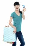 Shopaholic Woman Holding Her Cash Card Up Stock Photo