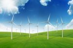 Wind Turbine On Green Grass Field Stock Photo