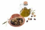 Green And Black Olives With Olive Oil Bottle Stock Photo