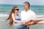 Man Carrying His Girl Friend Stock Photo