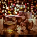 Hot Tea With Gift Box On Wooden Table Stock Photo