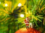 Miniature Santa Claus With Beautiful Light Bokeh Background. Chr Stock Photo