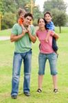 Couple Giving Piggyback Ride Stock Photo