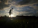 Silhouette  Running On Road At Sunrise Stock Photo