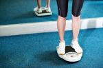 Cropped Image Of A Woman Measuring Weight Stock Photo