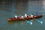 Unidentified Man And Boys Exhausted At The End Of A Rowing Boat Stock Photo