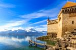 Castle By A Lake Front On A Blue Day Stock Photo