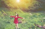 Summer Portrait Of Young  Women Enjoying Nature  In Tight Fitting Red Dress Summer Vacation,sunny,having Fun, Positive Mood,romantic, Against Background Of Summer Green Park, Green Leaves Stay Outdoor Stock Photo