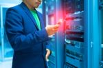 People Use Smart Phone In Datacenter Room Stock Photo