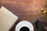 Hot Cup Of Coffee On Wooden Work Table Stock Photo