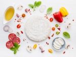 The Ingredients For Homemade Pizza On White Wooden Background Stock Photo