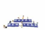 Miniature Worker Team Building Word Happy New Year Stock Photo