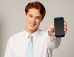 Salesman Displaying Newly Launched Mobile Stock Photo