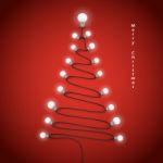 Colorful Light Bulbs And Christmas Tree Symbol .merry Christmas Stock Photo