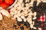 Variety Of Kitchen Ingredients With Fresh And Dried Legumes Stock Photo