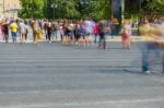 Blurry People Walking In The Street Stock Photo