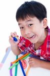 Child Show His Works From Clay, Over White. Strengthen The Imagi Stock Photo