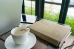 Coffee, Diary Book, Laptop And On Table In Cafe Stock Photo