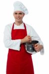 Smiling Confident Chef Holding Vessel Stock Photo
