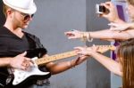 Guitarist Playing For His Fans Stock Photo