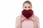 Woman Holding Gift Box In Form Of Heart Stock Photo