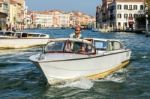 Motorboat Cruising Down The Grand Canal In Venice Stock Photo