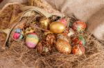 Colorful Painted Easter Egg From Fabric Bag On Hay Stock Photo