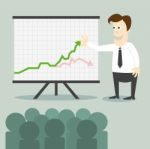 Business Man With Chart Presentation To People Stock Photo