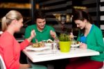 Family Enjoying Meal Outdoors Stock Photo