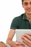 Teenage Boy holding Ipad Stock Photo