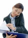 Businesswoman Working On Phone Stock Photo