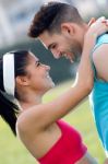 Young Couple In The Park After Exercise Stock Photo