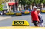 Yellow Taxi Sign On Cab Vehicle Roof Stock Photo