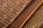 Traditional Brown Thai Fabric Pattern Stock Photo