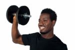 African Man Lifting Dumbbell Stock Photo