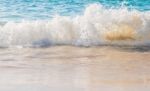 Sea Wave Splashing On The Beach Stock Photo