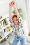 Beautiful Young Woman Listening To Music At Home Stock Photo