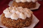 Cakes Decorated With Chocolate Meringue And Praline Stock Photo