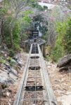 Down The Hill Railway, Train Track, With Forest And Blue Sky Stock Photo