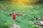 Summer Portrait Of Young  Women Enjoying Nature  In Tight Fitting Red Dress Summer Vacation,sunny,having Fun, Positive Mood,romantic, Against Background Of Summer Green Park, Green Leaves Stay Outdoor Stock Photo