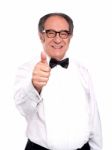 Smiling Old Man Gesturing Thumbs Up Stock Photo