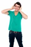 Cheerful Guy Enjoying Music Stock Photo