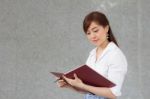 Portrait Of Thai Adult Businesswoman Beautiful Girl Read A Book Stock Photo